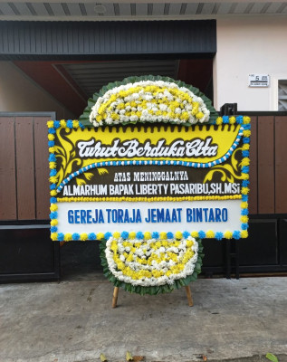 Papan Bunga Duka di Soko